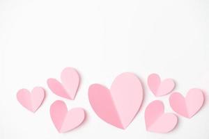 Shape of heart flying on white paper background. photo