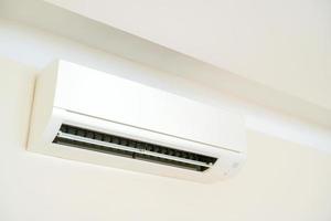 Air conditioner system on white wall room photo