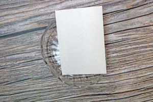 A5 paper greeting card mockup on wooden background photo