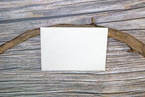 A5 paper greeting card mockup on wooden background photo