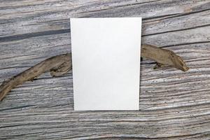 A5 paper greeting card mockup on wooden background photo