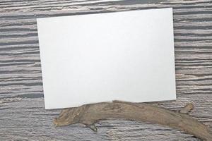 A5 paper greeting card mockup on wooden background photo