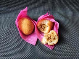 Indonesian Traditional Fritters  Combro, made from deep fried cassava and filled with spice inside photo