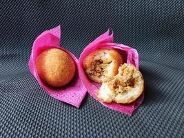Indonesian Traditional Fritters  Combro, made from deep fried cassava and filled with spice inside photo