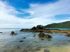 Stunning vibrant colour background during sunrise at Kuta Beach, Lombok, Indonesia photo