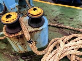 Old brown and gray frayed ship rope closeup. Classic texture. photo