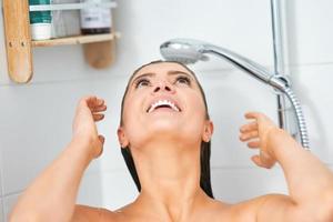 Young nice brunette woman in the bathroom photo