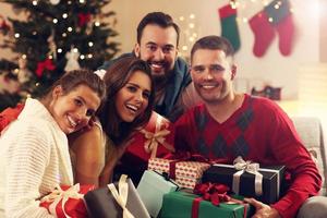 Group of friends with Christmas presents photo