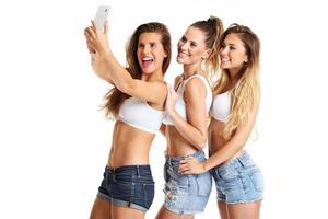 Group of happy friends posing in shorts photo