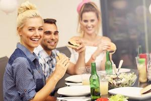 Group of friends having barbecue party photo