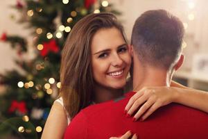 Young couple hugging in Christmas time photo