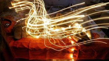 Headphones Surrounded By Fairy Lights In Long Exposure photo