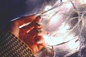 Woman holding fairy lights photo