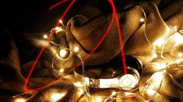 Headphones Surrounded By Fairy Lights In Long Exposure photo