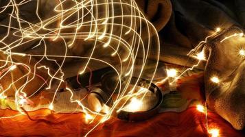 Headphones Surrounded By Fairy Lights In Long Exposure photo