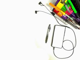 Flat lay,background mockup. the workspace in the background of the desk is white from the top view. layout space with mobile phones, books, pencils, stationery on a white desk background. photo