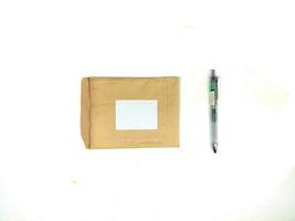 blank recycled paper stationery set mockup with white layout in the center and pen on the side photo