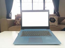 Mockup image, white blank screen laptop computer on the front display in modern home space. mockup laptop photo