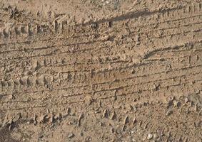 tyre footprint in soil background photo