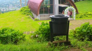 black trash can at tourist spot photo