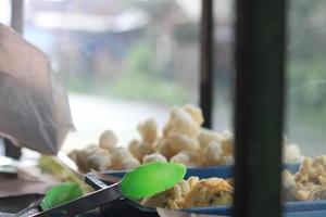 Geblek or cenolan is a traditional food from salaman, Magelang, made from tapioca flour and seasoned with savory fried onions. photo