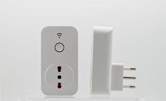 Smart wi-fi plug with energy monitor isolated on white background. photo