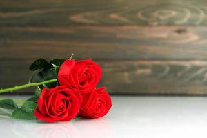 Red roses on table with copy space photo