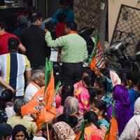 New Delhi, India, November 20 2022 - Bharatiya Janata Party BJP supporters during a rally in support of BJP candidate Pankaj Luthara to file nomination papers ahead of MCD local body Elections 2022 photo