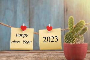 feliz año nuevo 2023 diseño de notas para el fondo foto