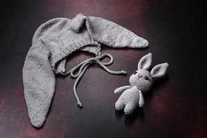 Cute knitted gray hat with ears for a small baby photo