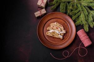 Tasty christmas stollen with marzipans, dried fruits and nuts photo