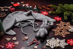 Cute knitted gray hat with ears for a small baby photo