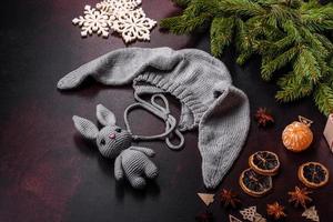 Cute knitted gray hat with ears for a small baby photo