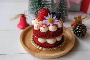 Festive red velvet cake with accessories for Christmas and new year event. photo