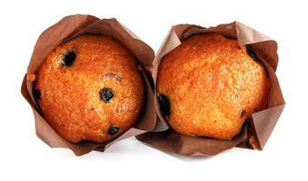 Two golden blueberry muffins isolated on white background. Full clipping path. photo