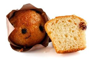 Whole and half muffin isolated on white background. Full clipping path. photo