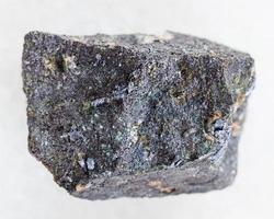 rough Molybdenite stone on white photo