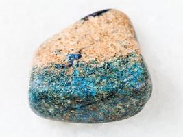 pebble of azurite stone on white photo