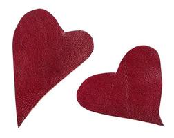 two cut out red leather hearts isolated photo