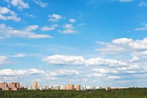 skyline with white clouds in blue sky photo