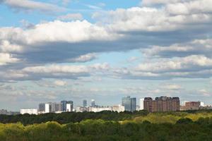 shadow of grey clouds on city in spring photo