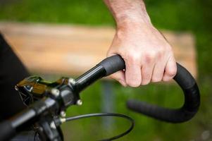 Cyclist with his bike, close up. Outdoor photography. photo