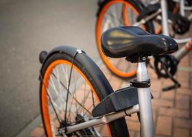 Bike rental on the main street of the city. Bike sharing system. photo