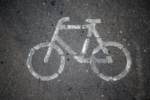 Bicycle or road sign. On asphalt. The view from the top. photo