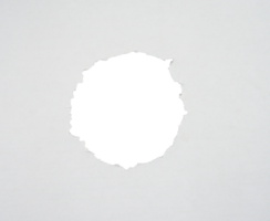 Torn paper with the curled ripped sides. a round black hole of torn on the white paper. realistic torn paper with the ripped edges for copy space and text. png