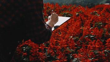 Selective focus. Architect team planning design apply renewable or solar energy on architectural building model with virtual reality technology hologram. Alternative green energy in future concept. video