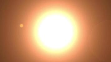 A flickering large light flash of a rounded shape in the form of the sun video