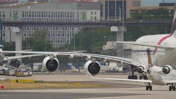 FRANKFURT AM MAIN, GERMANY JULY 17, 2017 - Lufthansa Regional Bombardier CRJ 900 taxiing after landing at Frankfurt International Airport, Germany FRA. In the background rides a huge Airbus A380 video