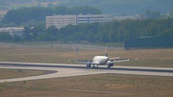 FRANKFURT AM MAIN, GERMANY JULY 19, 2017 - Airbus A319 of Lufthansa braking after landing at Frankfurt Airport. Tourism and travel concept, air flight video