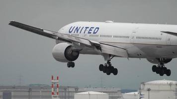 FRANKFURT AM MAIN, GERMANY JULY 20, 2017 - United Airlines Boeing 777 N226UA landing at runway 25L, slow motion. Fraport, Frankfurt, Germany video